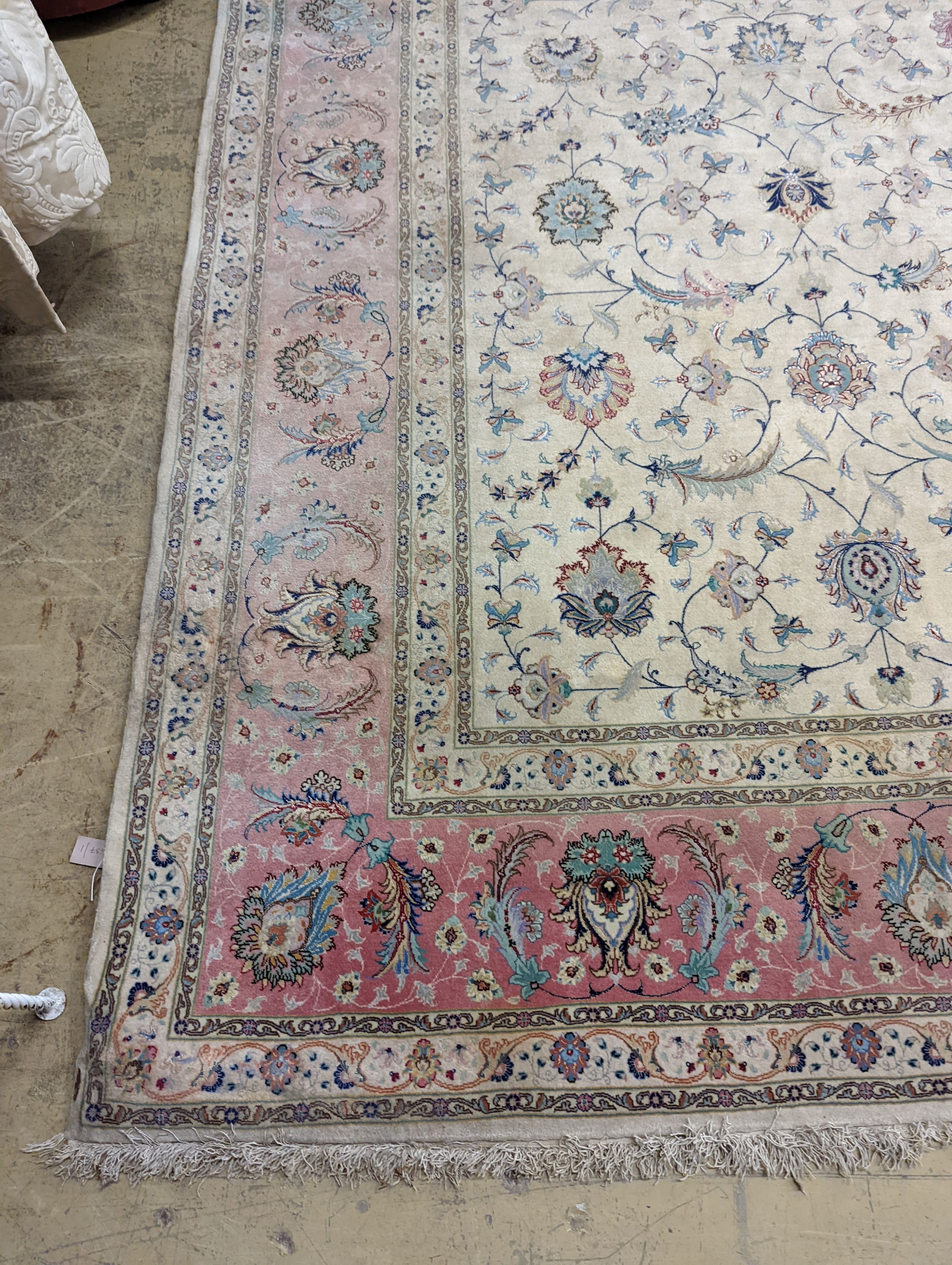 A Persian Tabriz ivory ground carpet, 410 x 300